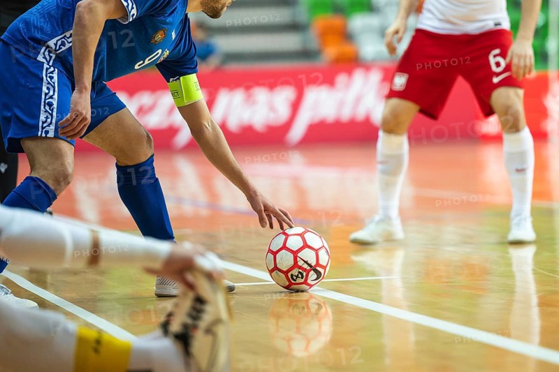LUBIN, POLAND - MARCH 12, 2025: Futsal match European Championship qualifiers Poland - Moldova 3:0. Detail of futsal ball and player out of field