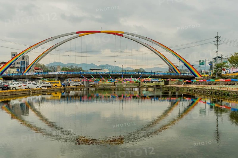 Youngdong County, South Korea. April 25, 2019: Paper lanterns hanging from double arch bridge over river in preparation for Buddha's birthday festivities