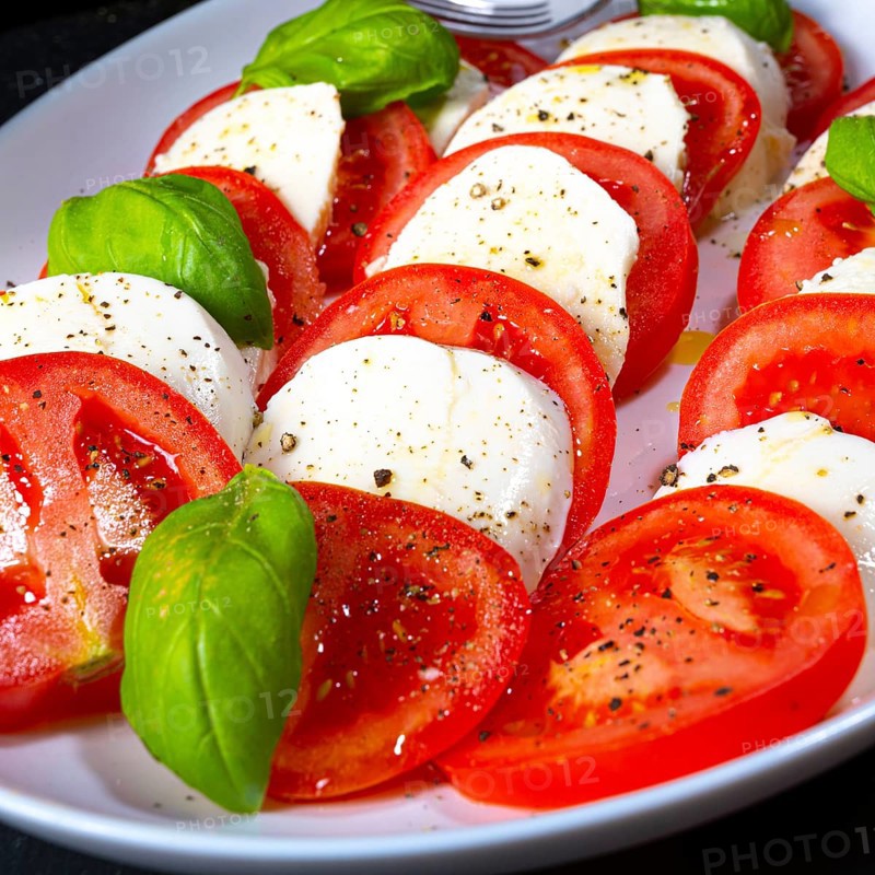 Tomatoes with mozzarella and basil