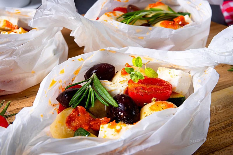 Baked dumplings with courgette, tomatoes and diced sheep's cheese