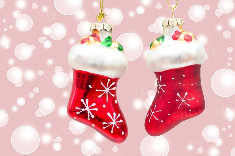 Two little red boots on pink bokeh background two little boots over pink bokeh background