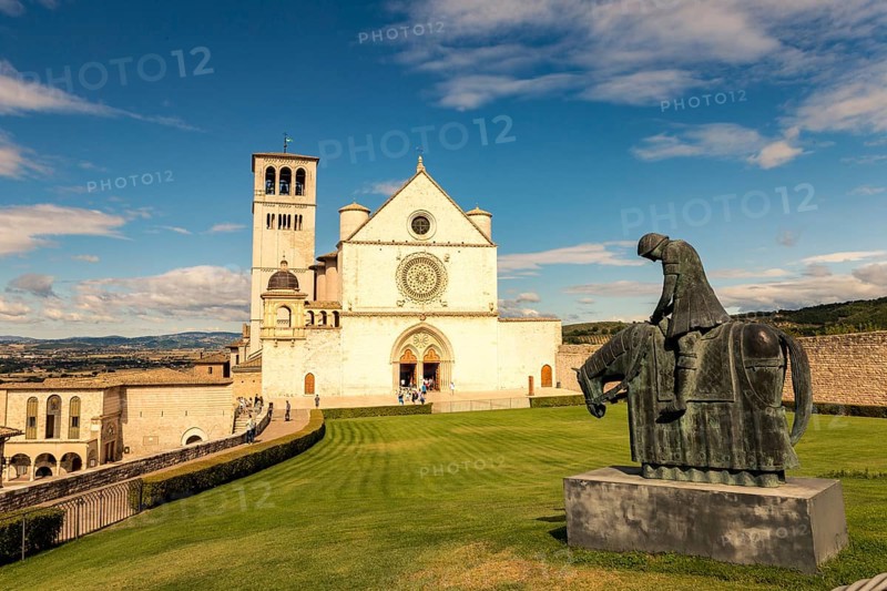 St. Francis of Assisi Church with the statue of St. Francis on a horse in the foreground. Francis is the patron saint of Italy. The bell tower can be seen from miles away