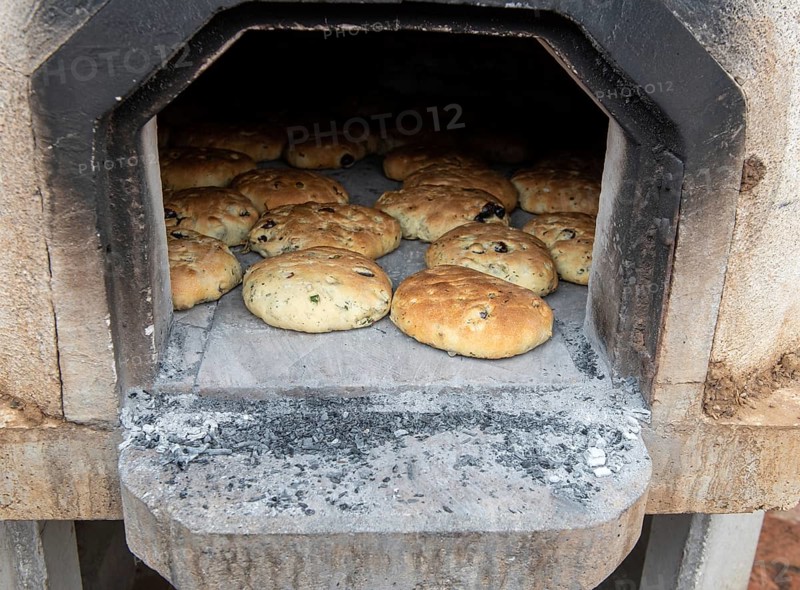 Fresh tasty healthy and delicious homemade olive pies cooked on the traditional clay oven in at a village in Cyprus