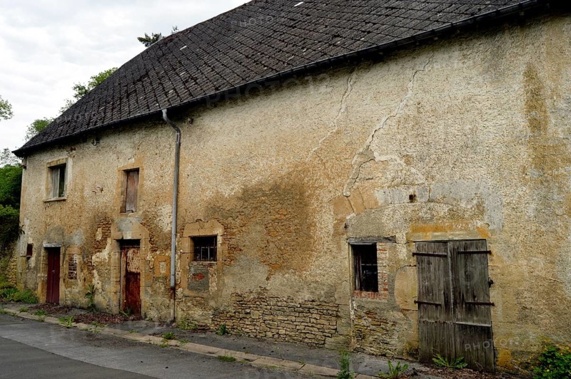 Old stone farm with cowsheds and horn of lodging house