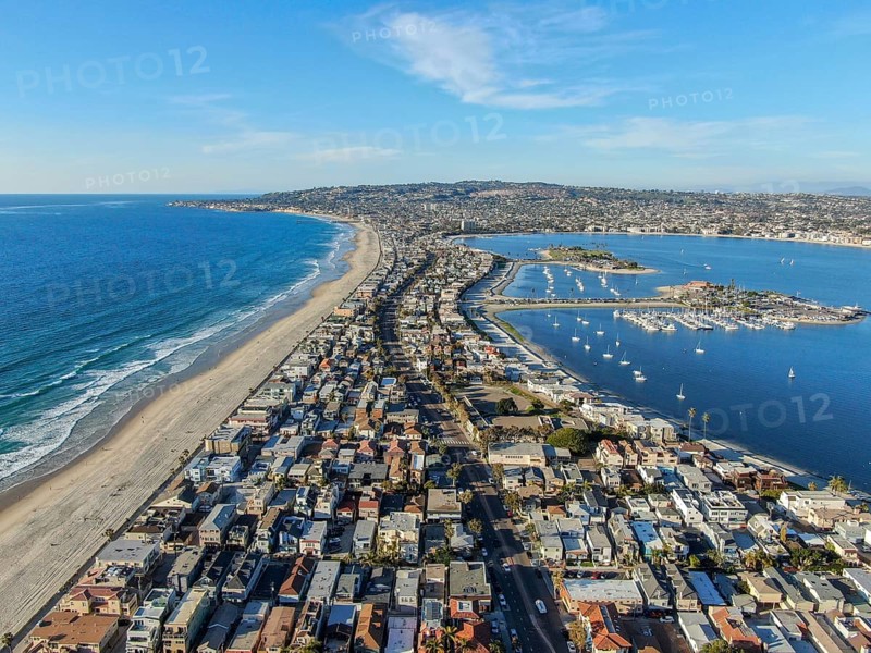 Aerial view of Mission Bay and Beaches in San Diego, California. USA. Community built on a sandbar with villas, sea port and recreational Mission Bay Park. Californian beach lifestyle