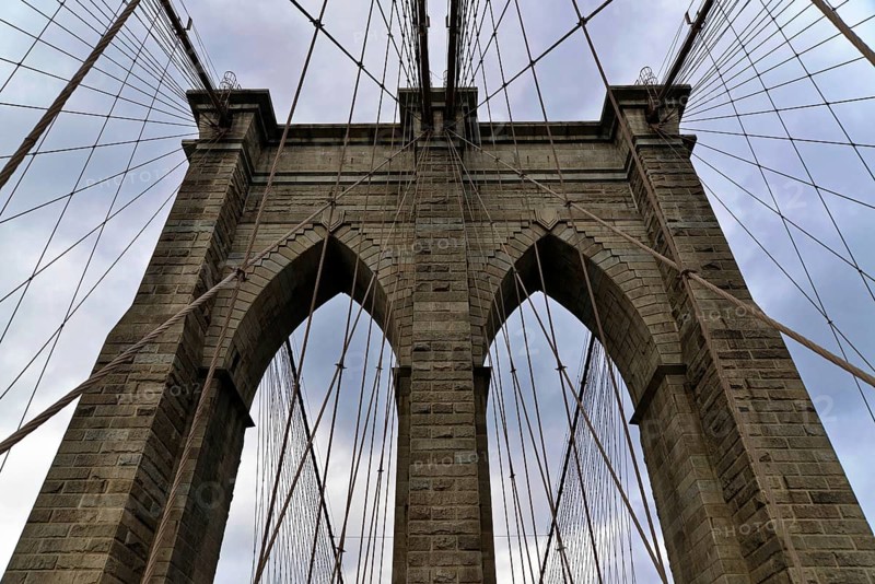 Brooklyn Bridge in Brooklyn, Manhattan, New York, USA United States of America, View of the impressive stone arch and cables of the Brooklyn Bridge, New York City, USA, North America