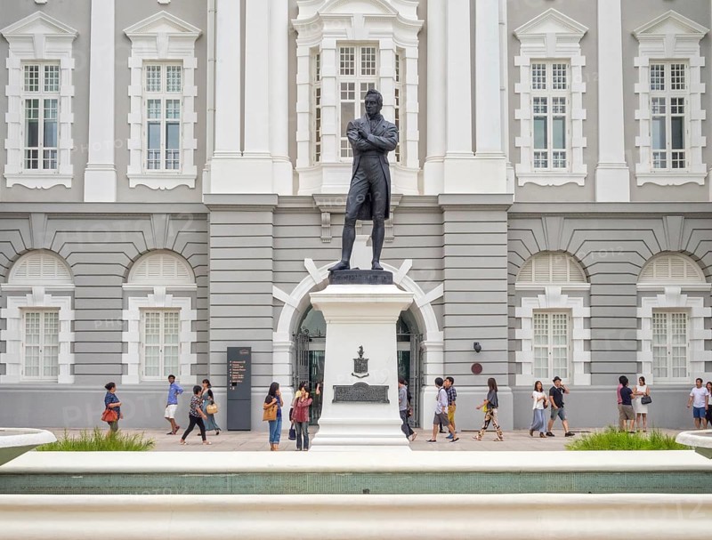 Bronze statue of Stamford Raffles by Thomas Woolner in front of the Victoria Theatre and Concert Hall, Singapore, Asia