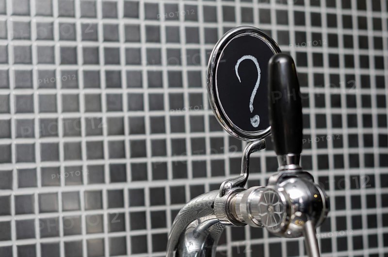 Beer tap with medallion with question mark as description
