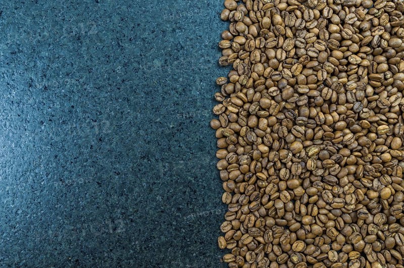 Texture, background of whole coffee beans, raw