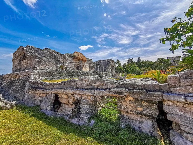 Ancient Tulum ruins Mayan site with temple ruins pyramids and artifacts in the tropical natural jungle forest palm and seascape panorama view in Tulum Mexico
