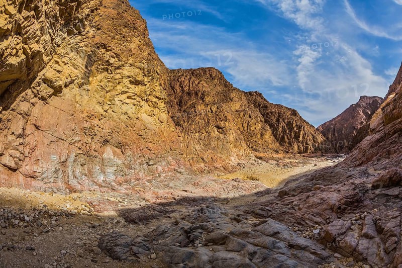 Israel in January. Picturesque and multi-color Black canyon in ancient Eilat mountains