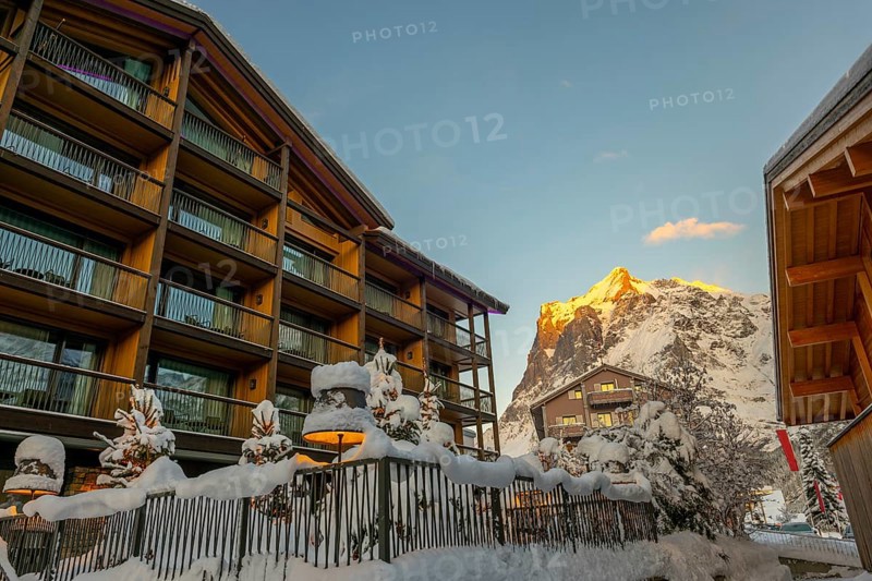 House and Mountain Peak in the Swiss Alps in a Snowy Winter Day in Grindelwald, Canton Bern, Switzerland, Europe