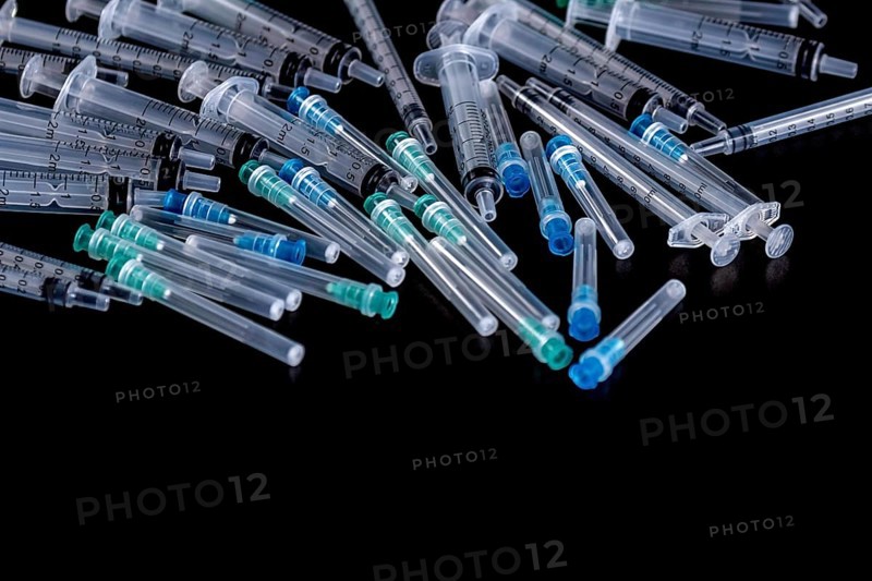 Medical Sterile Syringes Needles, Close up Syringes on Black Background