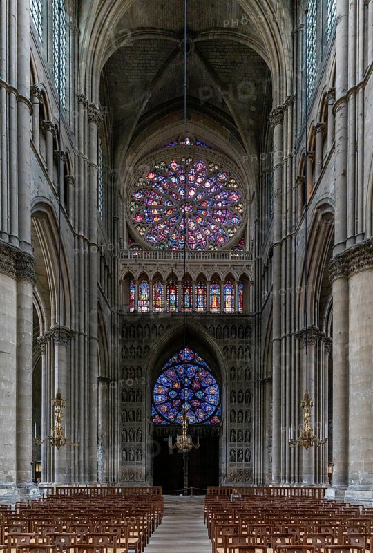 Reims, France- 13 September, 2022: view of the reverse side of the West Facade of the Reims Cathedral with colorful stained glass windows and sculptures