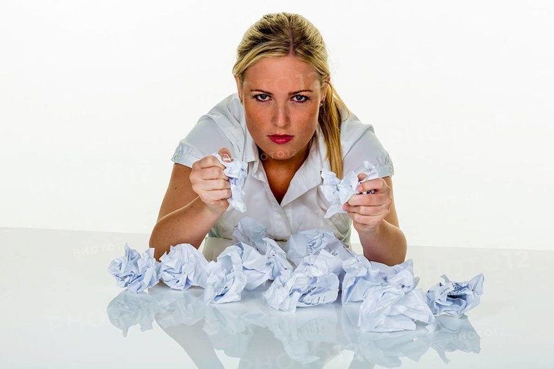 Young woman in the office is overwhelmed with work. burnout syndrome at work or study. Austria