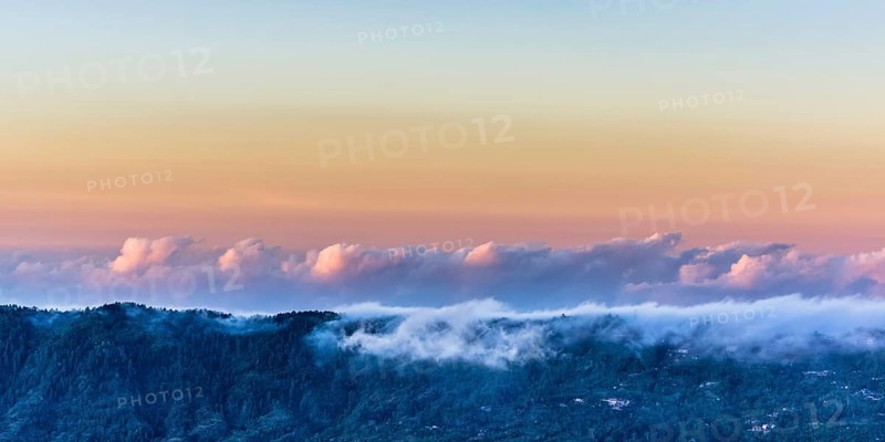 Amazing panorama view on clouds above mountain from summit of Batur volcano, Bali, Indonesia, Asia