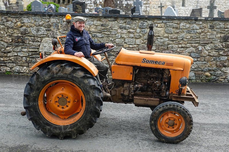 Old tractor Someca in front of church and chapel Sainte Nonne, vintage car meeting Dirinon, department Finistere Penn ar Bed, region Bretagne Breizh, France, Europe