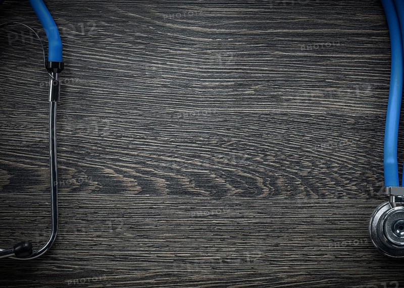 Stethoscope on vintage wooden board medicine concept