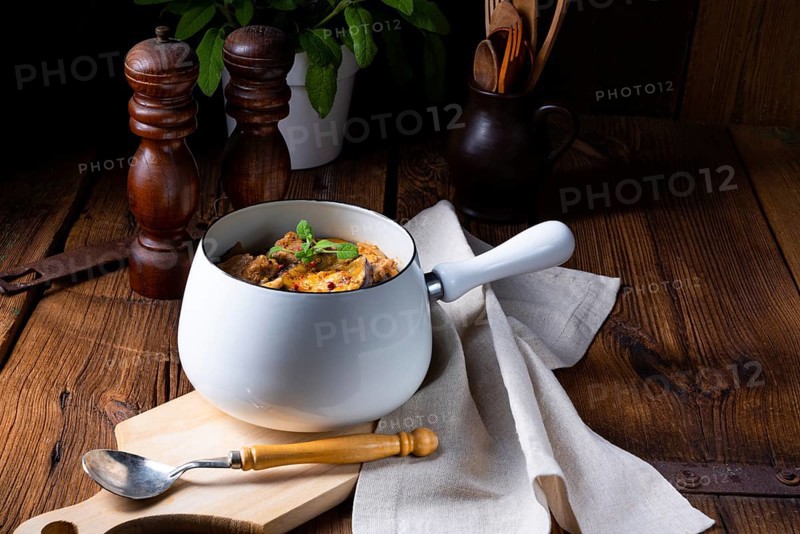 Veal goulash with baked aubergine and herbs