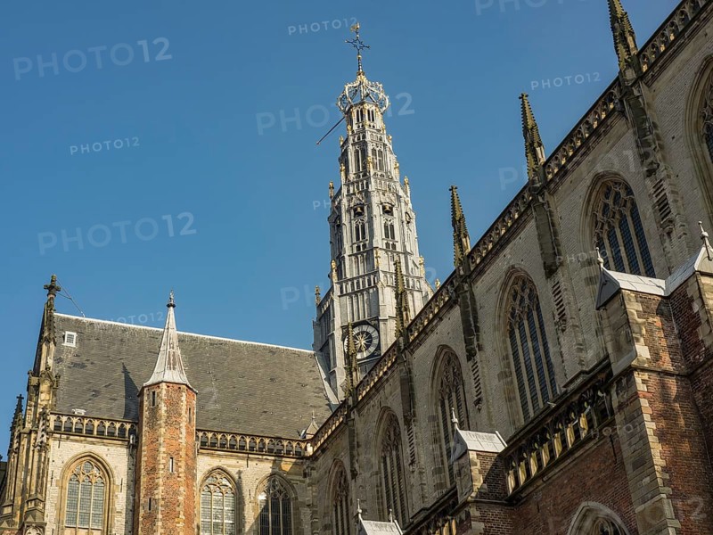 Gothic church architecture and church tower against the clear blue sky, haarlem, netherlands