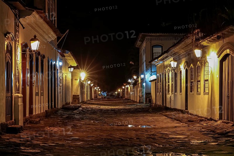 Atmospheric night view of illuminated street and buildings in historical center of Paraty, Brazil, Unesco World Heritage, South America