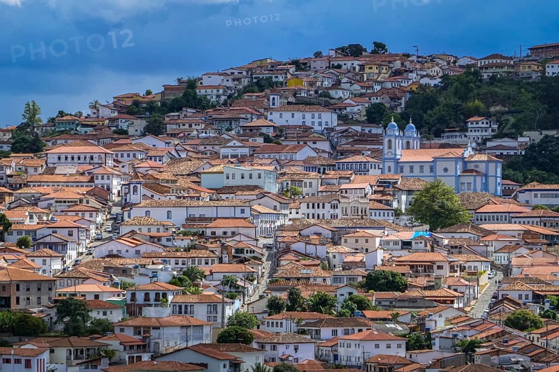 Close-up aerial view with sunshine, shadow and clouds to the historic town center of Diamantina, Minas Gerais, Brazil, South America
