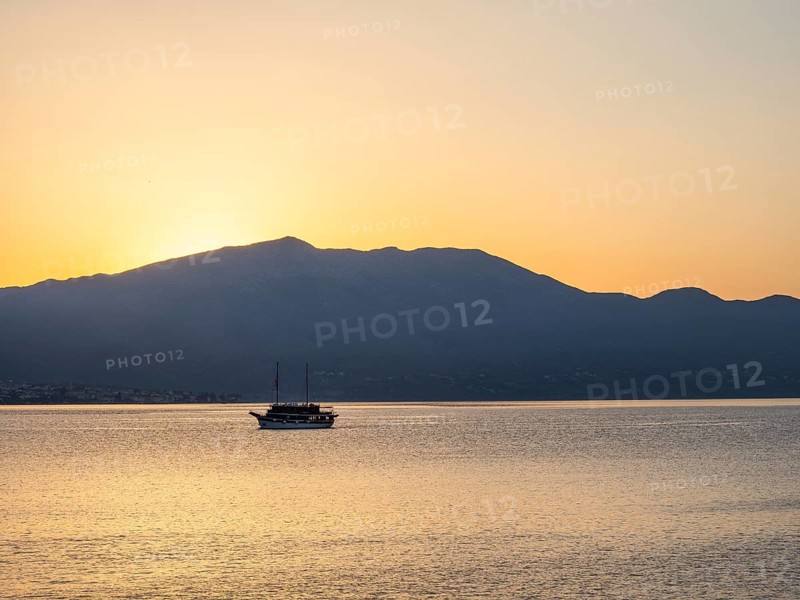 Ship in the morning light in front of sunrise, Peljesac peninsula, view from Korcula, Dalmatia, Croatia, Europe