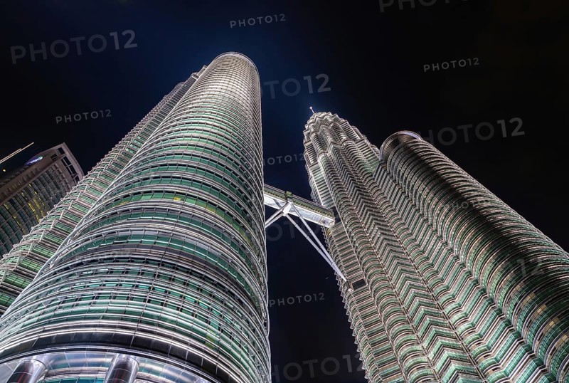A picture of the Petronas Twin Towers as seen from below at night