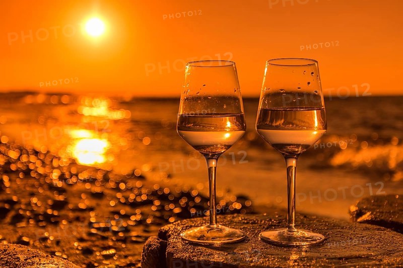 Wine on the baltic sea beach at sunset