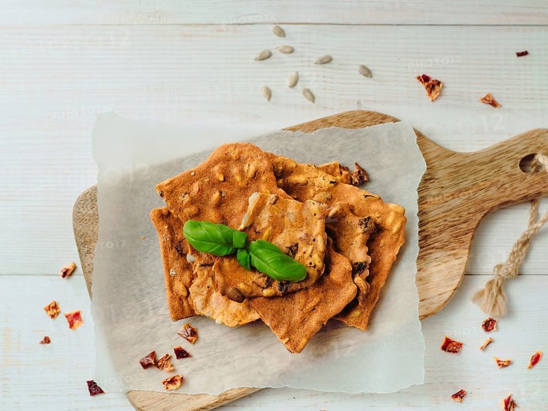 Gluten-freen crispbreads made of buskwheat flour. Green buckwheat flour smoked paprika sunflower seeds ingredients homemade baked crisp bread. Idea recipe snacks gluten free concept. Top view flat lay