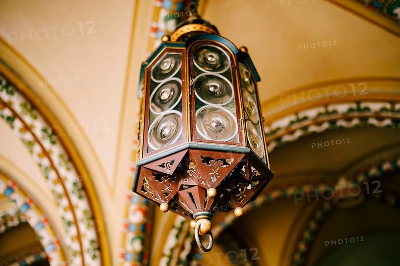 Antique German lamp on the ceiling. Octagon with Fresnel lenses.