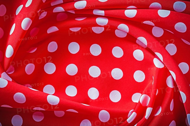 Red polka-dot fabric holidays concept