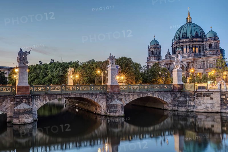 Berlin Cathedral and a bridge over the river at dusk