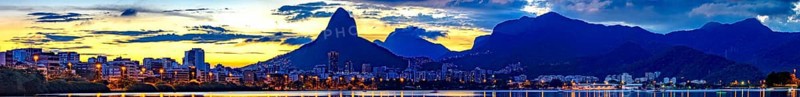 Panoramic image of summer sunset seen from the lagoon Rodrigo de Freitas with the buildings of the city of Rio de Janeiro, Two Brothers hill and Gavea stone