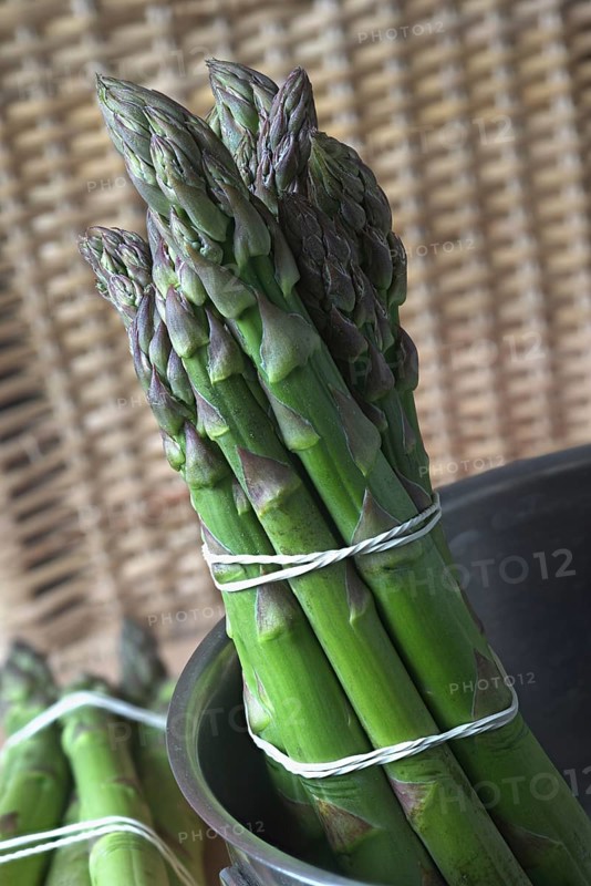 A bunch of green asparagus in a saucepan