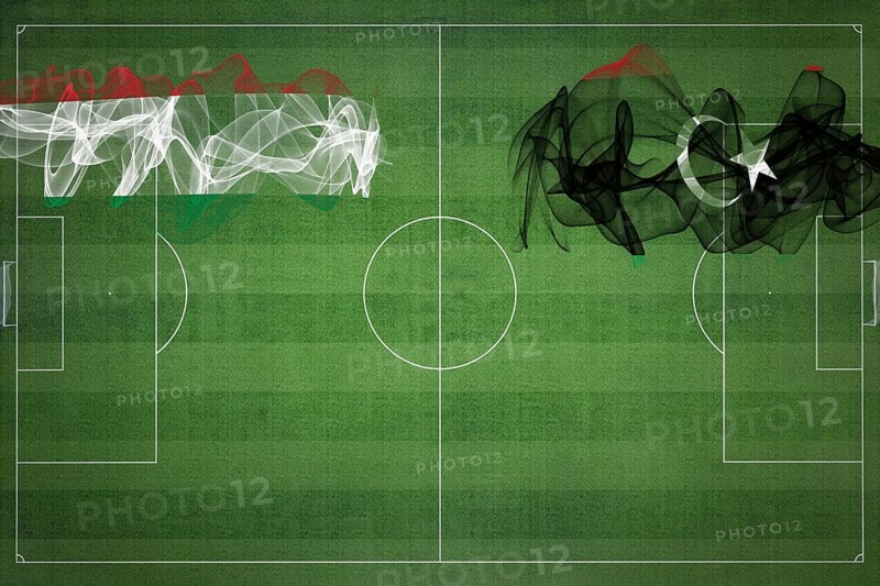 Hungary vs Libya Soccer Match, national colors, national flags, soccer field, football game, Competition concept, Copy space