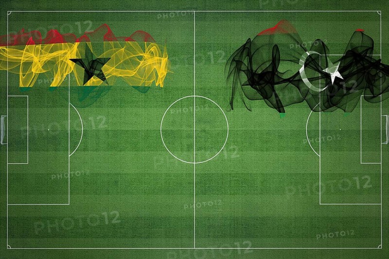 Ghana vs Libya Soccer Match, national colors, national flags, soccer field, football game, Competition concept, Copy space