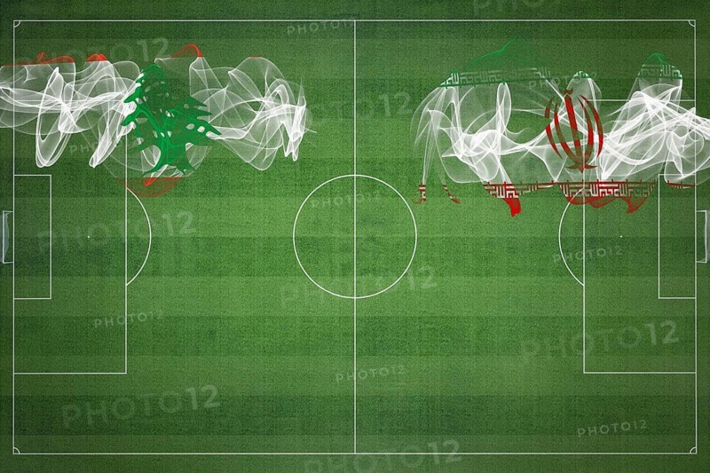 Lebanon vs Iran Soccer Match, national colors, national flags, soccer field, football game, Competition concept, Copy space