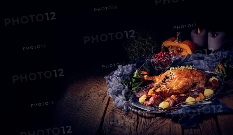 Roast duck with potato dumplings and plums
