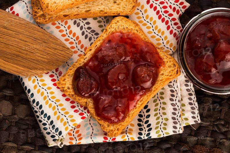 Breakfast of cherry jam on toast