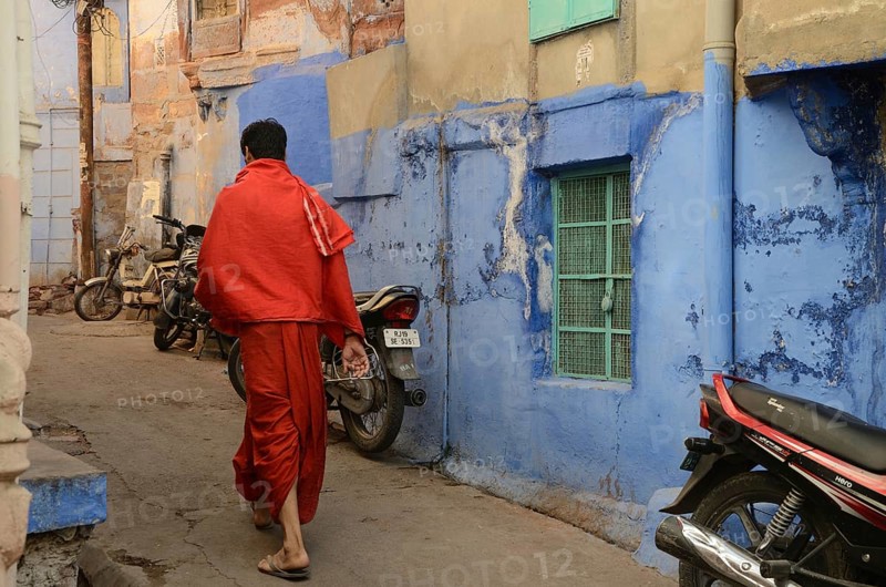 Priest walking in narrow lane, jodhpur, rajasthan, India, Asia, NOMR, Asia