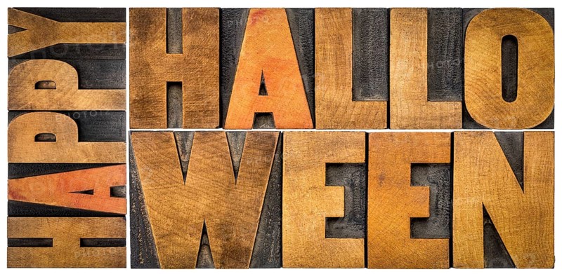 Happy Halloween banner or greeting card - isolated word abstract in vintage grunge letterpress wood type