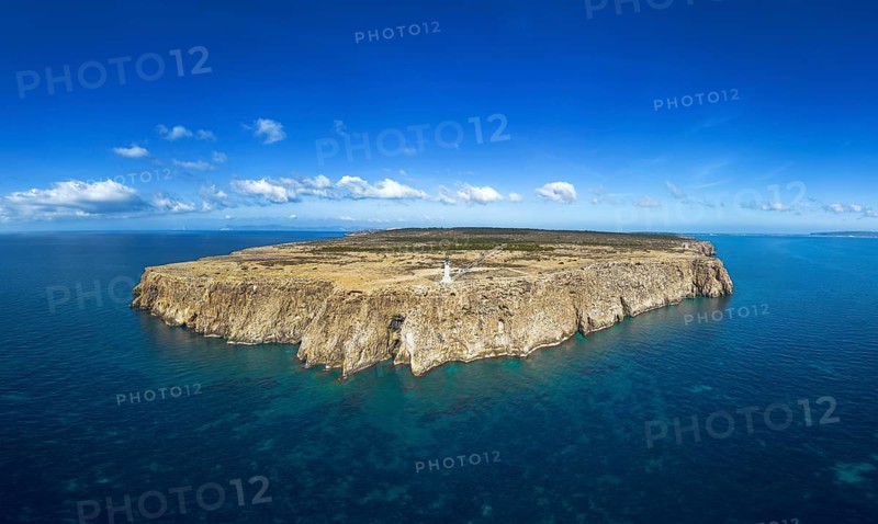 Aerial landscape view of Cap de Barbaria and the landmark lighthouse on Formentera Island