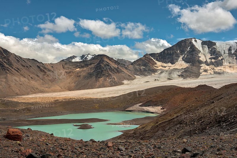 Mountain landscape with glaciers and lake near Elbrus on Caucasus, Russia, Europe