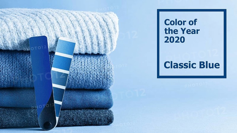 Stack of sweaters and color fun palette in classic blue 2020 color. Color of year 2020 concept for fashion and clothing industry. Banner