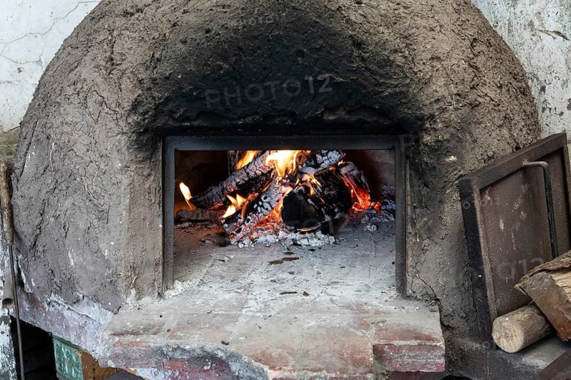 Clay oven with wood burning inside
