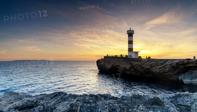 A view of the lighthouse at Colonia Sant Jordi in Mallorca at sunset
