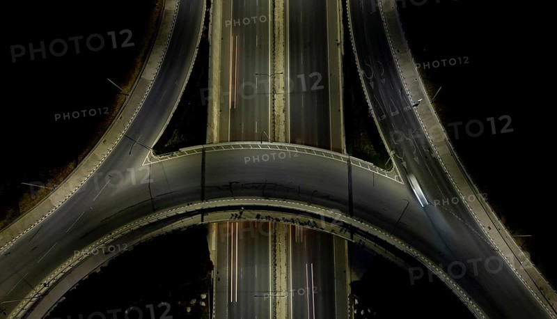 Aerial drone top view of a modern motorway junction roundabout with cars moving fast. Transportation infrastructure, Nicosia Cyprus