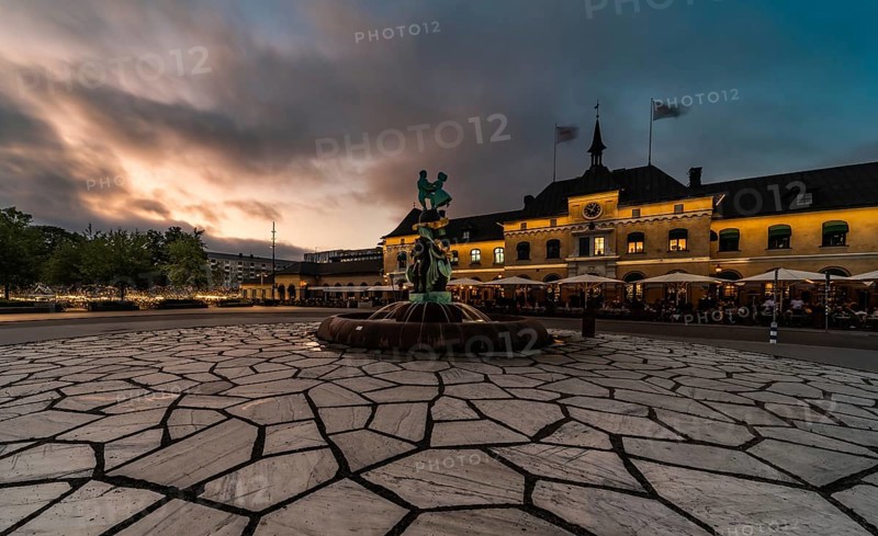 Uppsala, Uppland, Sweden, 07 27 2019 Facade of the Railway station and the square by night, Europe