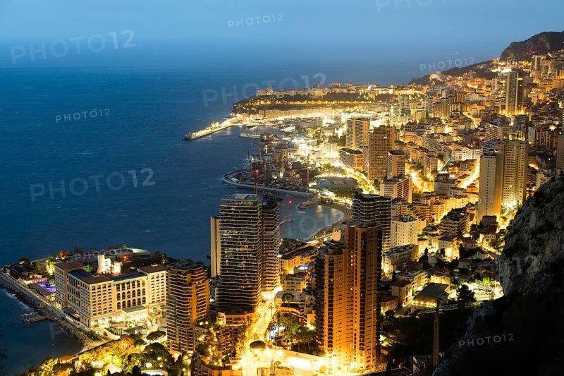 Monte Carlo panorama illuminated by night. Urban landscape with luxury architecture